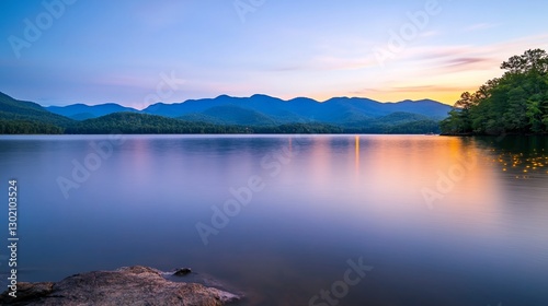 Serene sunset over mountain lake