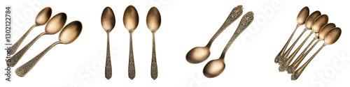 An still life image featuring a collection of elegant bronze and copper vintage style spoons and other cutlery items arranged in a minimalist and sophisticated composition