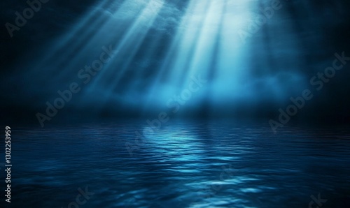 Dark blue background with rays of light shining down on the water surface