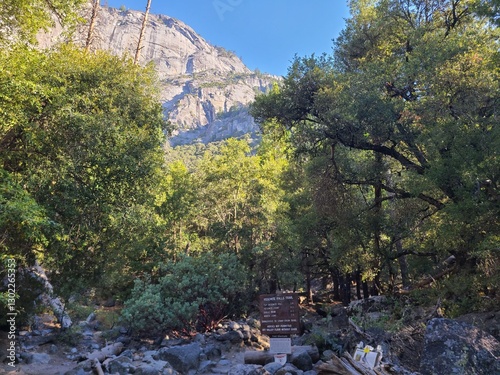 Photography A trail sign with mileages for Yosemite Falls in Yosemite National Park, Califor