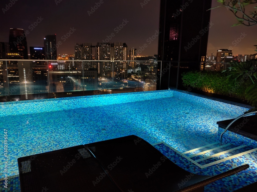 Fototapeta premium Singapore - January 21, 2025: Infinity swimming pool at The Clan Hotel, Singapore by Far East Hospitality in Singapore on January 21, 2025.
