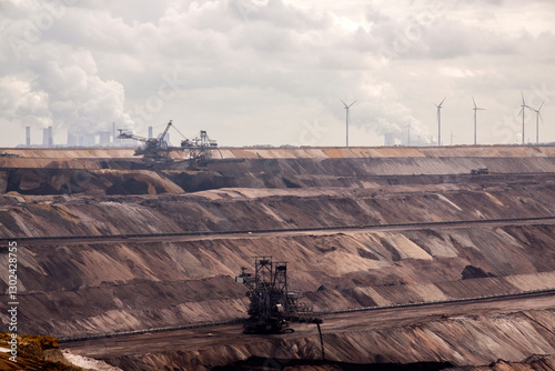 Obraz na płótnie Germany, North Rhine Westphalia, -june 2017: ground excavator in action moving mullock and soil at open pit coal mine; Germany,for winning brown coal w salonie
