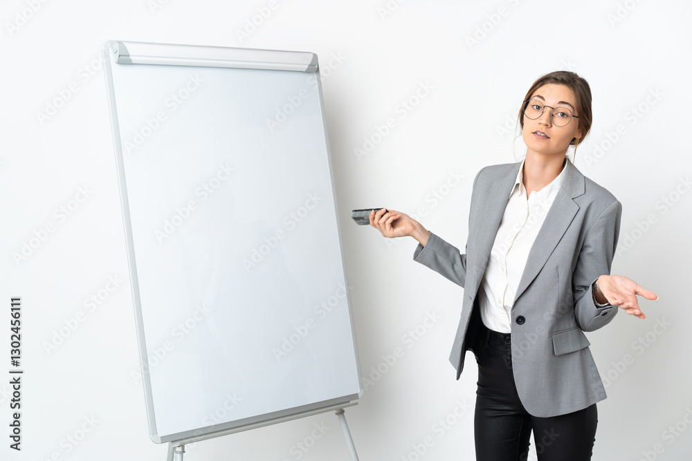 Young Ireland woman isolated on white background giving a presentation on white board Young Ireland woman isolated on white background giving a presentation on white board