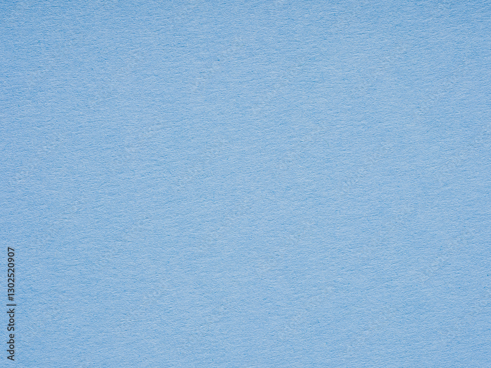 Obraz premium A serene sky blue canvas, the textured paper invites thoughts as light and airy as a springtime breeze