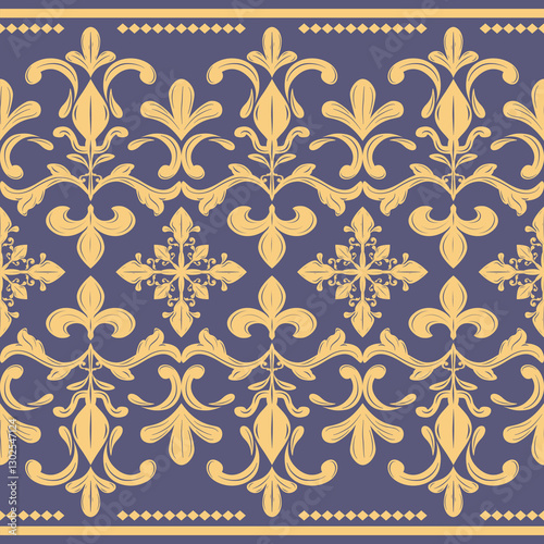 Beautiful Exquisitely Detailed Gold Lily Fleur de lis Baroque Design on Blue Denim Background. Luxury Seamless Border Petals Scroll Ornament Silk Weaves Embroidery Nobel Expensive Richness Decoration