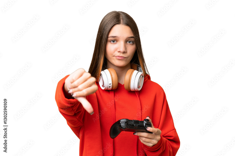 Teenager caucasian girl playing with a video game controller over isolated background showing thumb down with negative expression Teenager caucasian girl playing with a video game controller over isolated background showing thumb down with negative expression