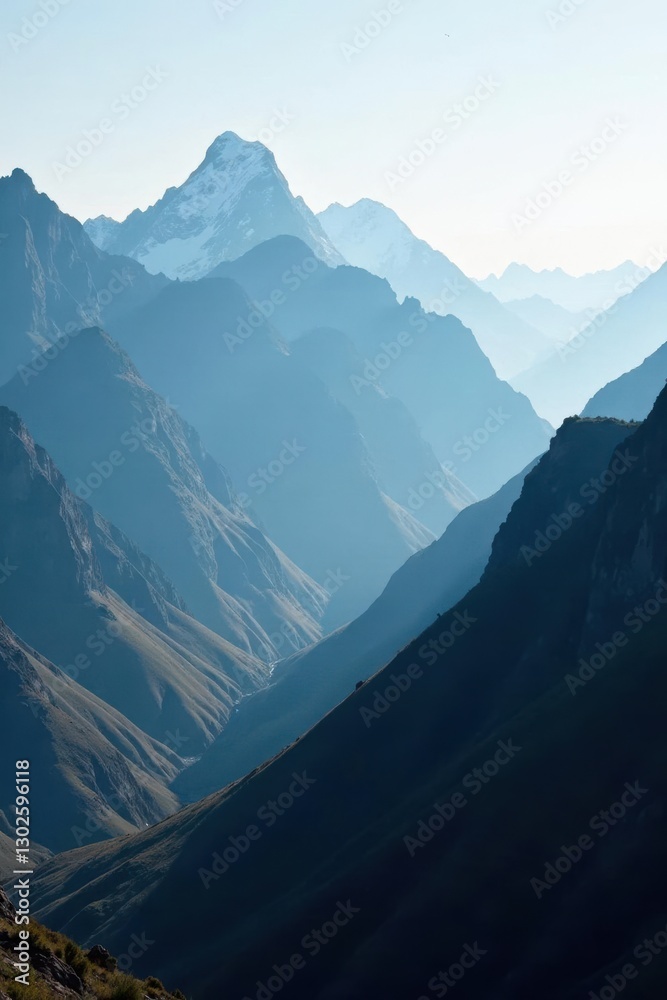 Fototapeta premium Dark mountain range with a white misty veil in the distance, atmosphere, solitude