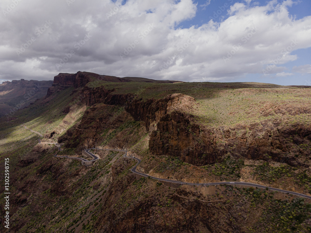 Fototapeta premium Aerial View of Rocky Cliffs and Winding Road