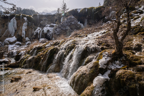 Pearl Shoal Waterfall in winter season, is a waterfall located in Jiuzhaigou, Sichuan Province, China, steam, cascade