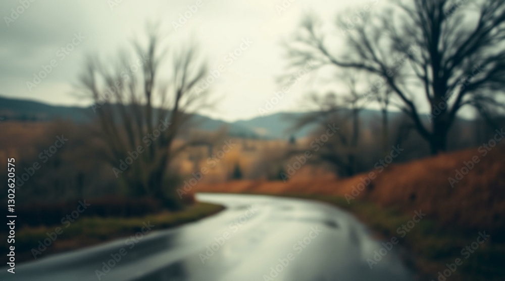 Fototapeta premium A soft, blurred background showcasing a misty landscape with trees and distant hills, creating a tranquil and atmospheric scene ideal for nature-themed projects.