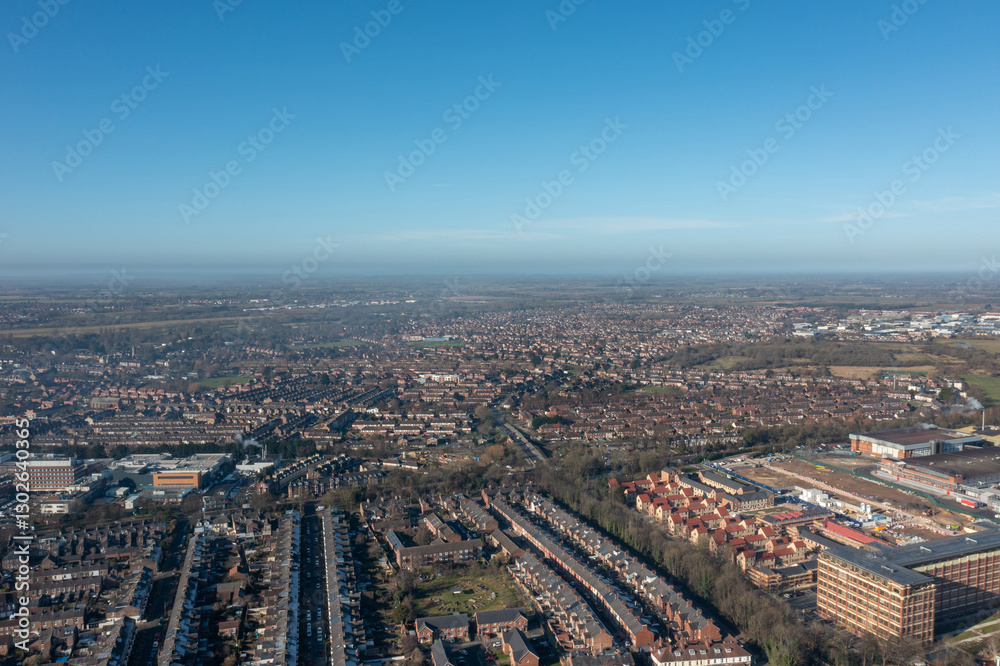 Aerial drone photo of the city of York in North Yorkshire England showing a birds eye view of the British town and rows of houses and large suburban housing estates taken in the winter time