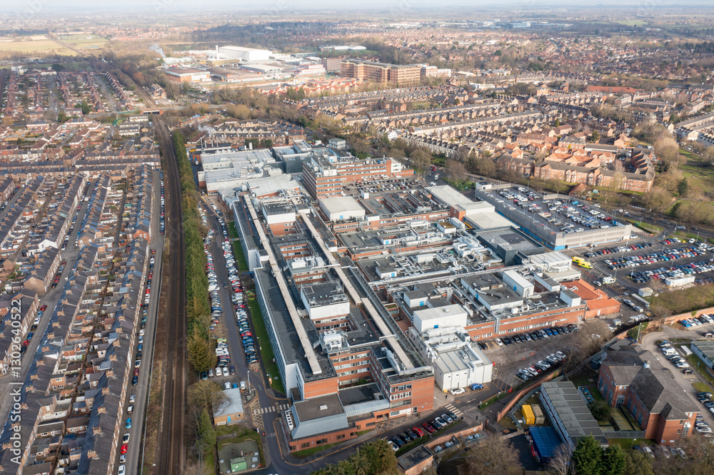 Aerial drone photo of the city of York in North Yorkshire, England showing the large buildings that make up the NHS York Hospital buildings surrounded by streets of terrace houses in the winter time