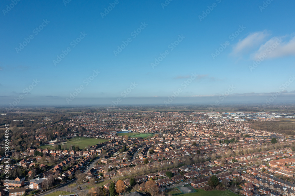 Aerial drone photo of the city of York in North Yorkshire England showing a birds eye view of the British town and rows of houses and large suburban housing estates taken in the winter time