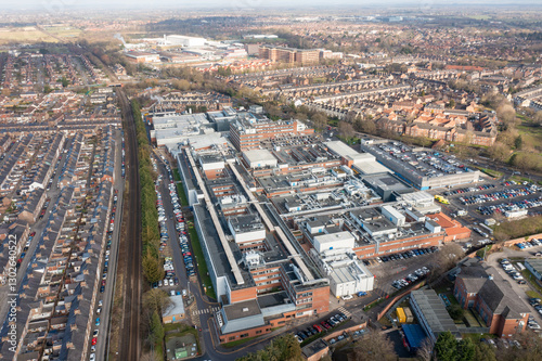 Obraz na płótnie Aerial drone photo of the city of York in North Yorkshire, England showing the large buildings that make up the NHS York Hospital buildings surrounded by streets of terrace houses in the winter time w salonie