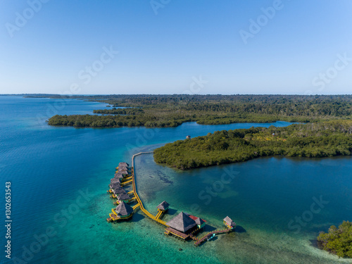 Aerial shot of luxury hotel and water bungalow in the Caribbean sea, Bocas del Toro island, Panama - stock photo