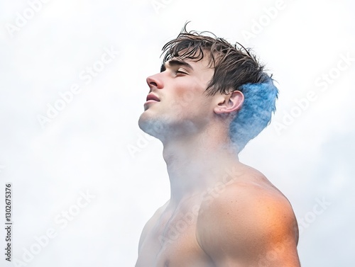 Artistic portrait of a young man emerging from mist against a minimal white background conveying mystery and ethereal beauty photo