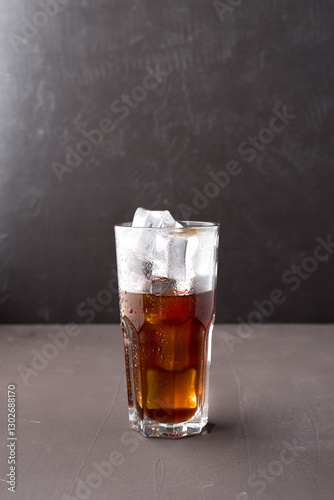 Cold iced coffee in a clear cup.