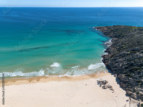 Fototapeta Naklejka Na Ścianę i Meble -  Su Giudeu bay, with crystal clear water and white sand, view from the drone, Su Giudeu beach, Chia, Domus de Maria, Sardinia, Italy