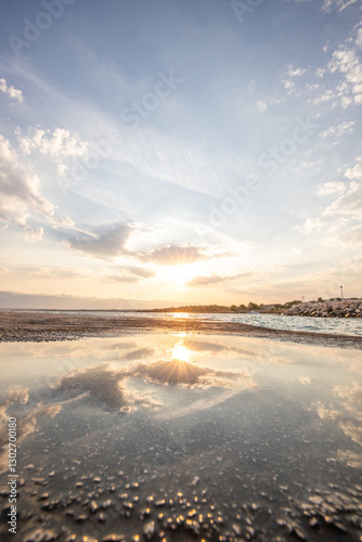 Fototapeta Naklejka Na Ścianę i Meble -  Bay with a small harbor, in the morning. Beautiful sunrise on the Mediterranean Sea. Mediterranean coast and landscape Beach Plaža Lozice on the island of Vir, Zadar, Dalmatia, Adriatic Sea, Croatia