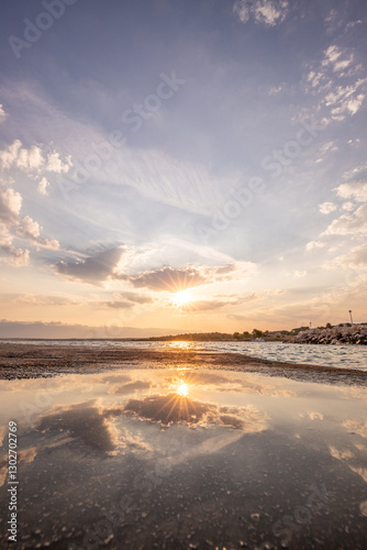 Fototapeta Naklejka Na Ścianę i Meble -  Bay with a small harbor, in the morning. Beautiful sunrise on the Mediterranean Sea. Mediterranean coast and landscape Beach Plaža Lozice on the island of Vir, Zadar, Dalmatia, Adriatic Sea, Croatia