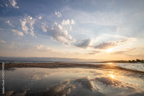 Fototapeta Naklejka Na Ścianę i Meble -  Bay with a small harbor, in the morning. Beautiful sunrise on the Mediterranean Sea. Mediterranean coast and landscape Beach Plaža Lozice on the island of Vir, Zadar, Dalmatia, Adriatic Sea, Croatia