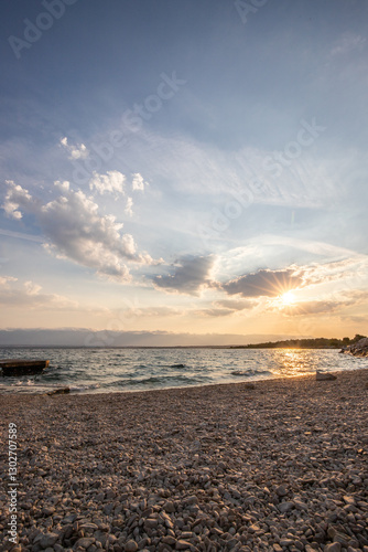 Fototapeta Naklejka Na Ścianę i Meble -  Bay with a small harbor, in the morning. Beautiful sunrise on the Mediterranean Sea. Mediterranean coast and landscape Beach Plaža Lozice on the island of Vir, Zadar, Dalmatia, Adriatic Sea, Croatia