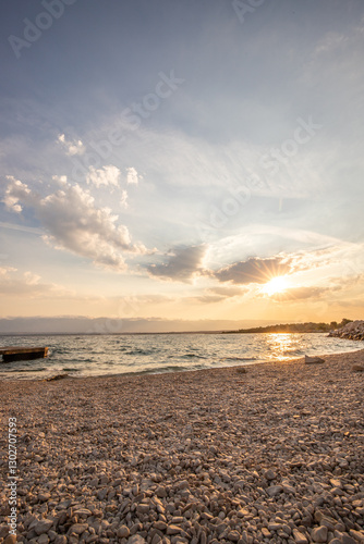 Fototapeta Naklejka Na Ścianę i Meble -  Bay with a small harbor, in the morning. Beautiful sunrise on the Mediterranean Sea. Mediterranean coast and landscape Beach Plaža Lozice on the island of Vir, Zadar, Dalmatia, Adriatic Sea, Croatia