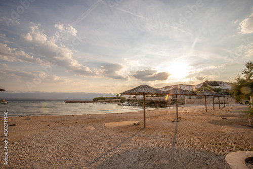 Fototapeta Naklejka Na Ścianę i Meble -  Bay with a small harbor, in the morning. Beautiful sunrise on the Mediterranean Sea. Mediterranean coast and landscape Beach Plaža Lozice on the island of Vir, Zadar, Dalmatia, Adriatic Sea, Croatia
