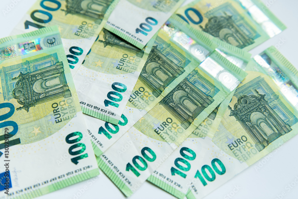 euro banknotes background for finance. onehundred bills at the table in closeup euro banknotes background for finance. onehundred bills at the table in closeup