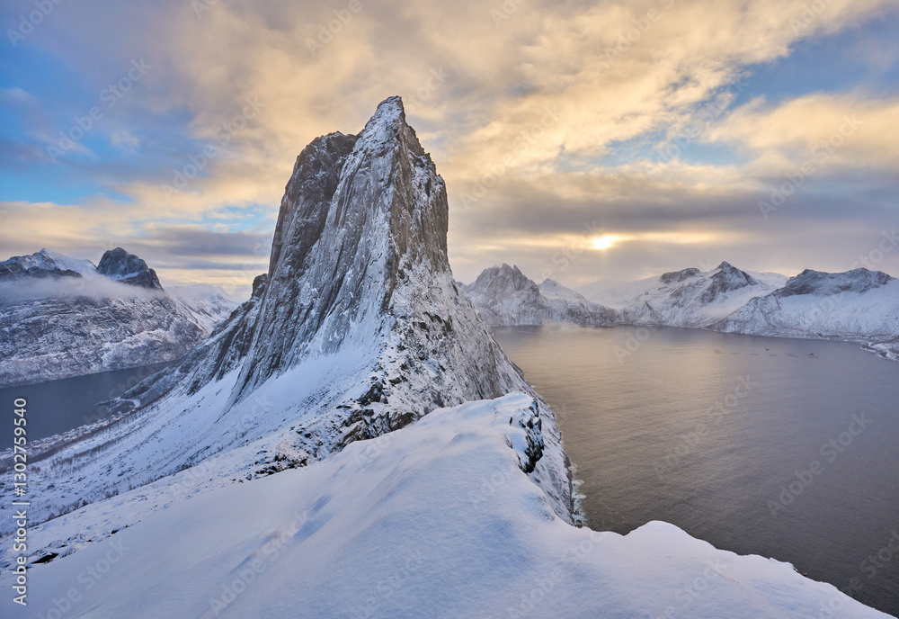 Obraz premium icy winter landscape of the snowy Segla summit near Fjordgard, the most famous mountain on Senja Island in northern Norway