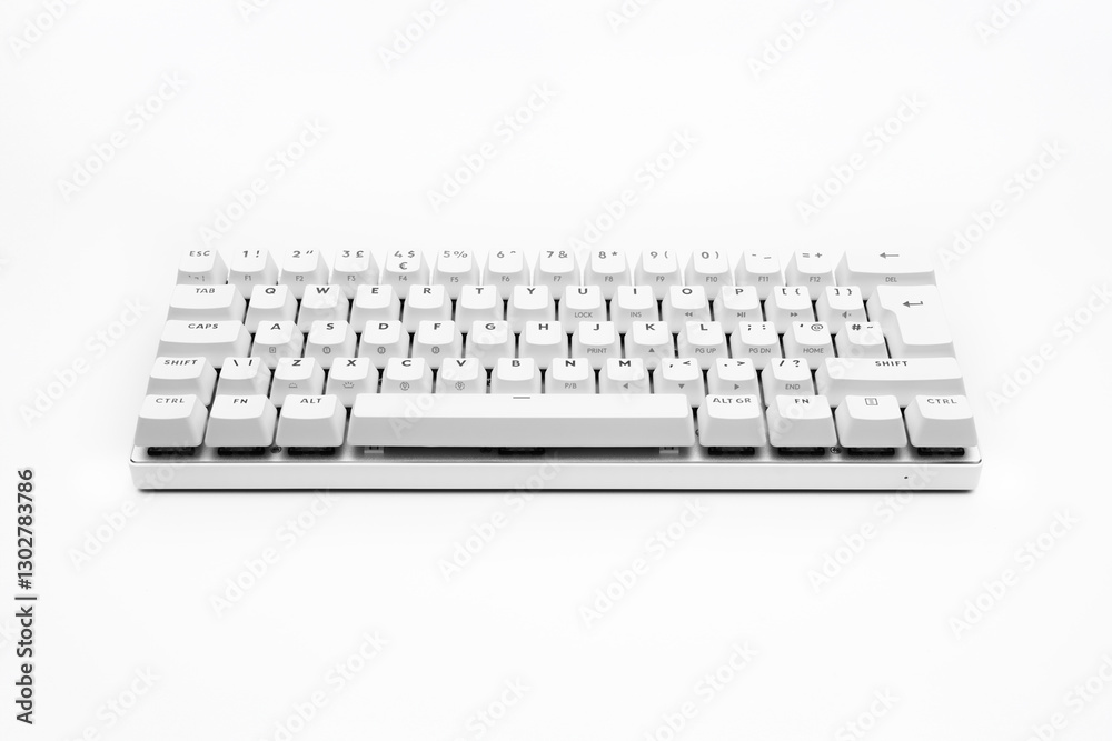 White, wireless gaming mechanical computer keyboard closeup, isolated. Minimal, modern design on white background. front view. 60 percent keyboard. copy space. Communication device. White, wireless gaming mechanical computer keyboard closeup, isolated. Minimal, modern design on white background. front view. 60 percent keyboard. copy space. Communication device.