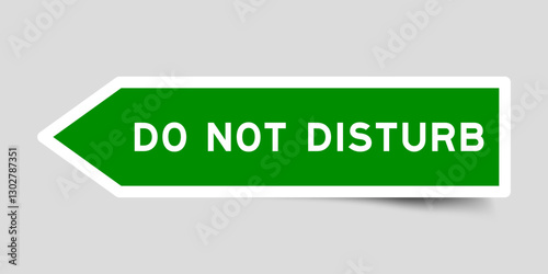 Green color arrow shape sticker label with word do not disturb on gray background