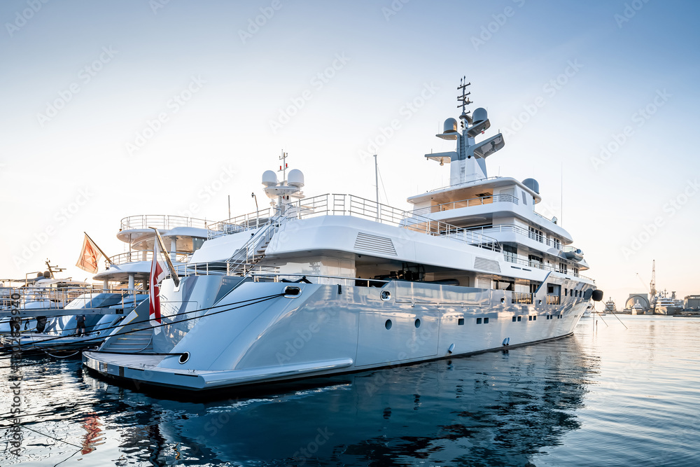 Side view of a large surperyacht located in Genova Italy after yard maintenance Side view of a large surperyacht located in Genova Italy after yard maintenance