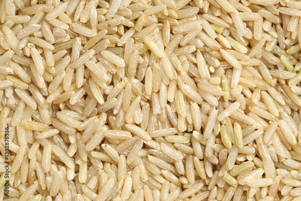 Pile of brown rice as background, top view Pile of brown rice as background, top view