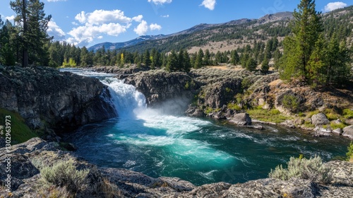 Scenic Waterfall at Whitefish Montana with Turquoise Water and Blue Sky