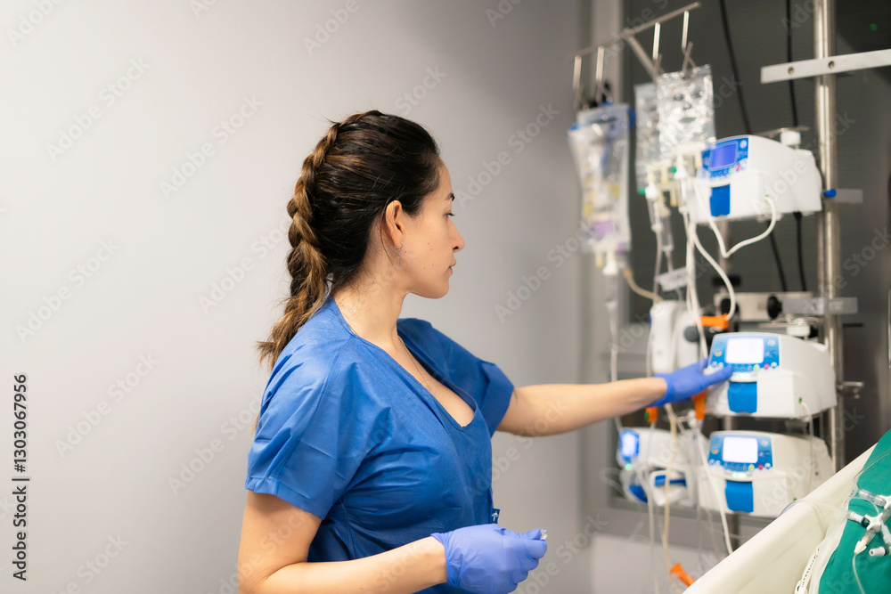 Nurse adjusting medical equipment in hospital setting Nurse adjusting medical equipment in hospital setting