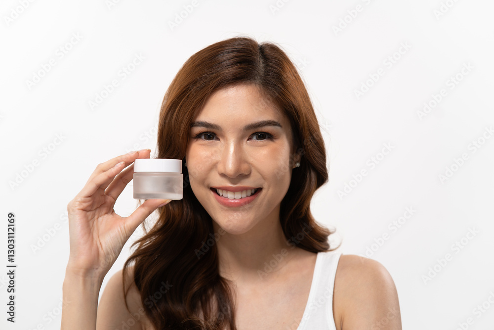 Beauty expert showcases skincare routine with a smiling Asian woman holding a cream jar against a clean background Beauty expert showcases skincare routine with a smiling Asian woman holding a cream jar against a clean background