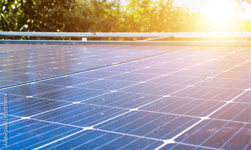 Solar panels, generators of solar power. Concept of environmental conservation and clean energy production
