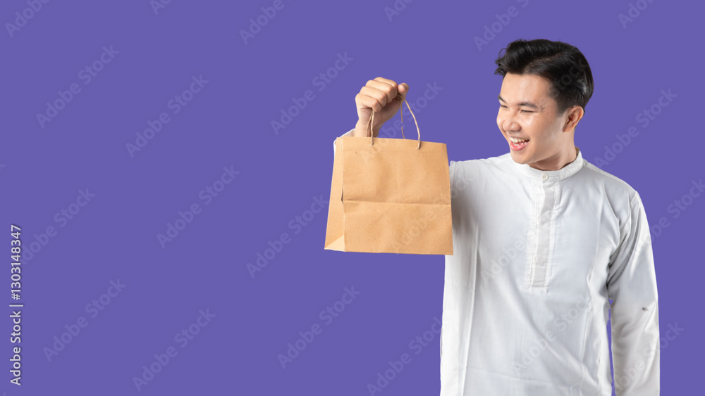A man holds a brown paper bag and smiles. Ramadan and Eid celebrations on purple background