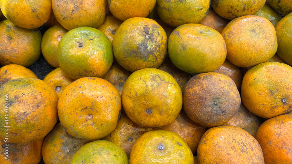 Overripe Oranges Spread Across a Market Display During the Daytime Overripe Oranges Spread Across a Market Display During the Daytime