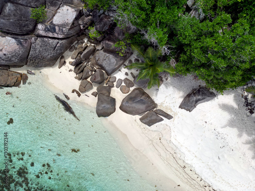 Anse Cocs beach, La Digue Seychelles, tropical beach during a luxury vacation in Seychelles. Tropical beach Anse Cocs beach, La Digue, Praslin, Mahe Seychelles with turqouse colored ocean photo