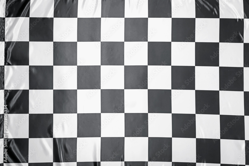 Fototapeta premium Checkered finish flag as background, top view