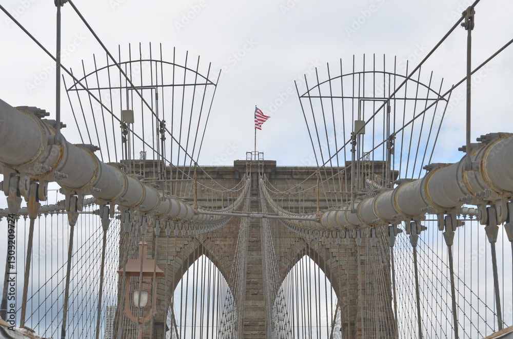 Fototapeta premium Close-Up of Brooklyn Bridge with American Flag with view to the sky made 2011