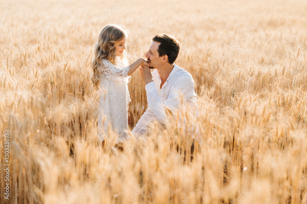 Child, parents play in nature. The concept of a happy child in the family. The girl kisses her father on the field. Family. Horizontal photo. Child, parents play in nature. The concept of a happy child in the family. The girl kisses her father on the field. Family. Horizontal photo.