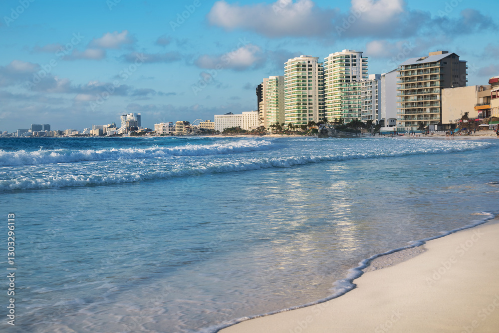 White sand beach in Cancun city center in pink sunrise light, Mexico
