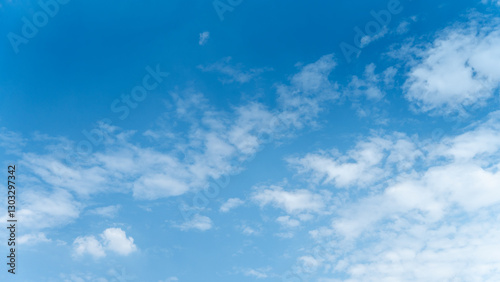 Fototapeta Naklejka Na Ścianę i Meble -  The sky is a vibrant, cloudless blue, while the sun shines brightly, making it appear even more radiant.