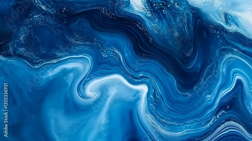 An abstract, fluid artwork depicting swirling blue and white colors, resembling waves or marble.