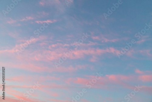 Tranquil Sunset Sky with Soft Pink and Blue Hues in Clouds