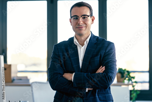 Wallpaper Mural Cheerful businessman is looking at camera while crossing arms in the office Torontodigital.ca