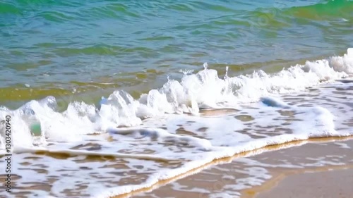 Clear Ocean Wave Crashing on Sandy Beach.